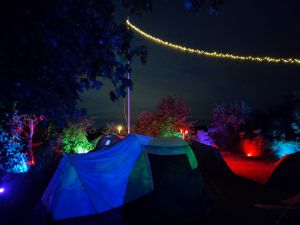 Colored tents at south pole at nicht with colorful lights